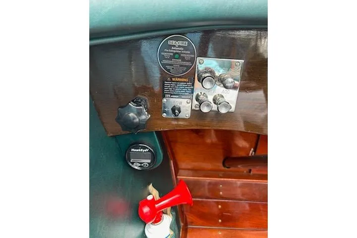 Slide: The Image of Control panel of a 1997 Hacker-Craft 26' Runabout with gauges and switches. - 29