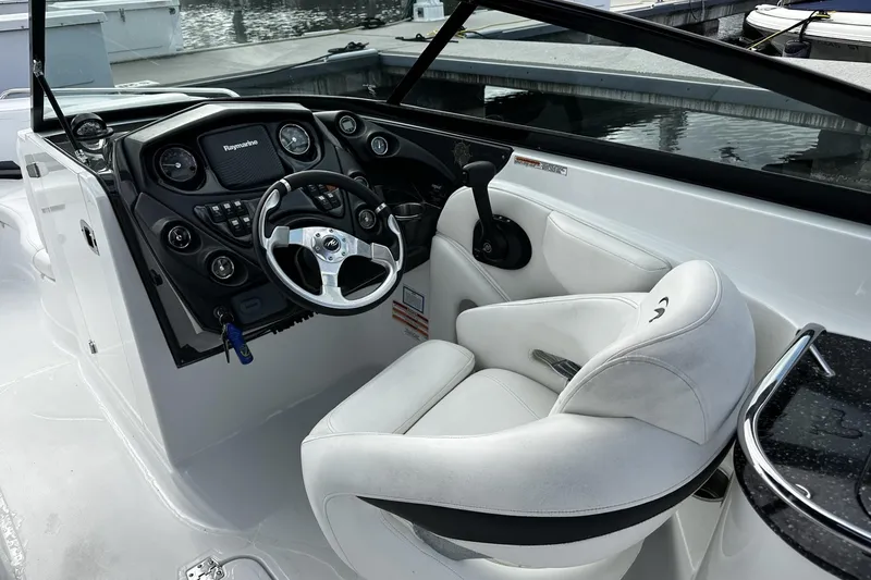 Slide: The Image of Cockpit of 2015 Monterey 264FS boat with steering wheel and control panel. - 19