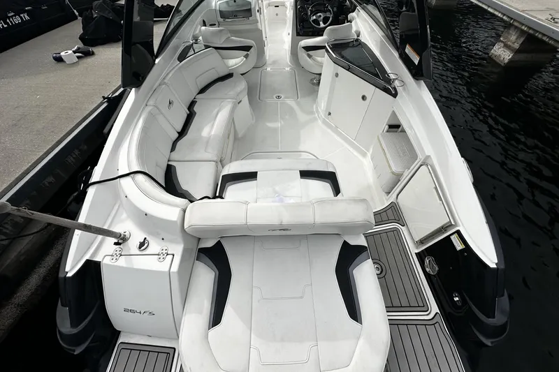 Slide: The Image of 2015 Monterey 264FS boat interior with white seating and sleek design. - 27