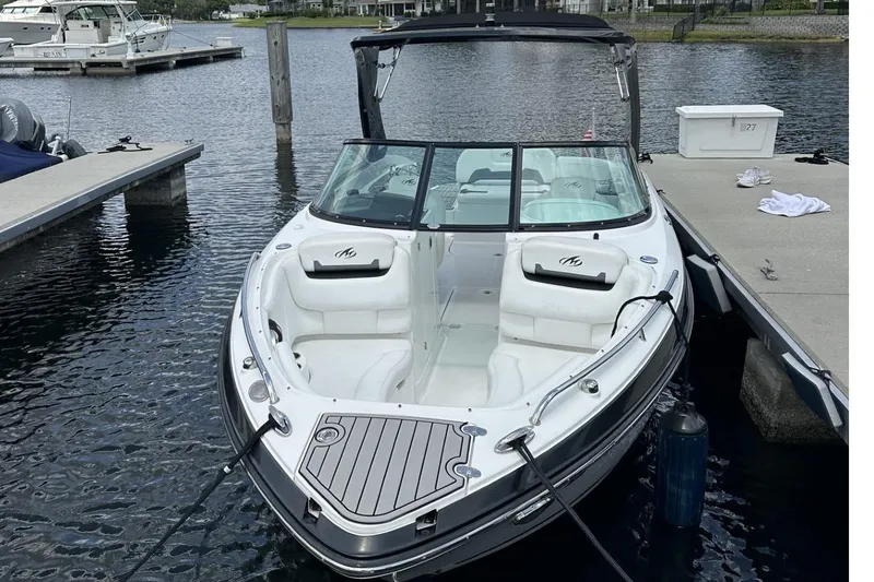 Slide: The Image of 2015 Monterey 264FS boat docked at marina, featuring sleek design and spacious seating. - 3