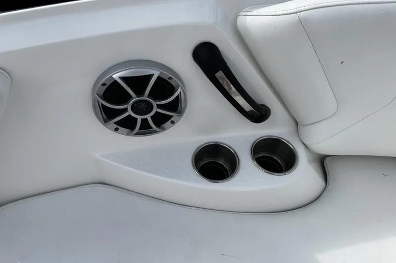 Slide: The Image of Interior detail of a 2015 Monterey 264FS boat, featuring cup holders and speaker. - 39