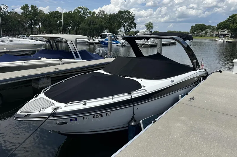 Slide: The Image of 2015 Monterey 264FS boat docked at marina under cloudy sky. - 41