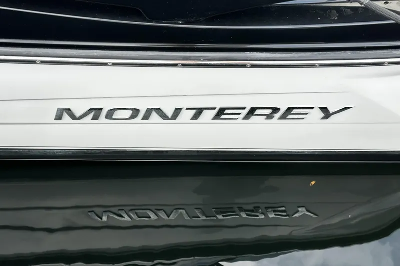 Slide: The Image of Monterey 264FS 2015 boat nameplate with reflection on water surface. - 44