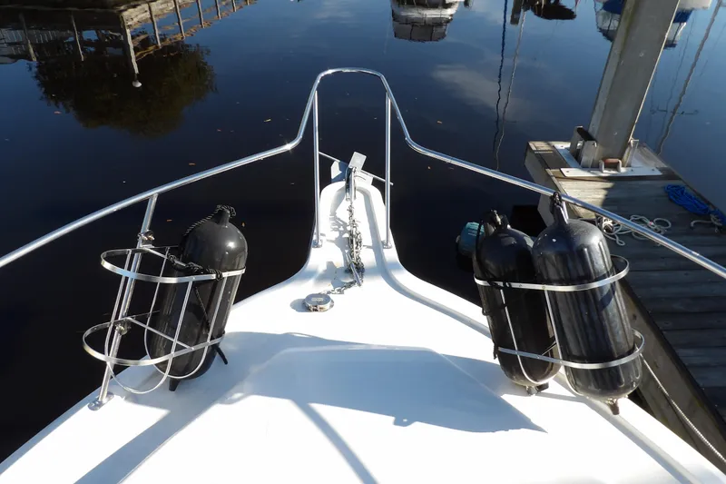 Slide: The Image of Bow view of 1992 Carver 28 Aft Cabin Motor Yacht docked at marina. - 7