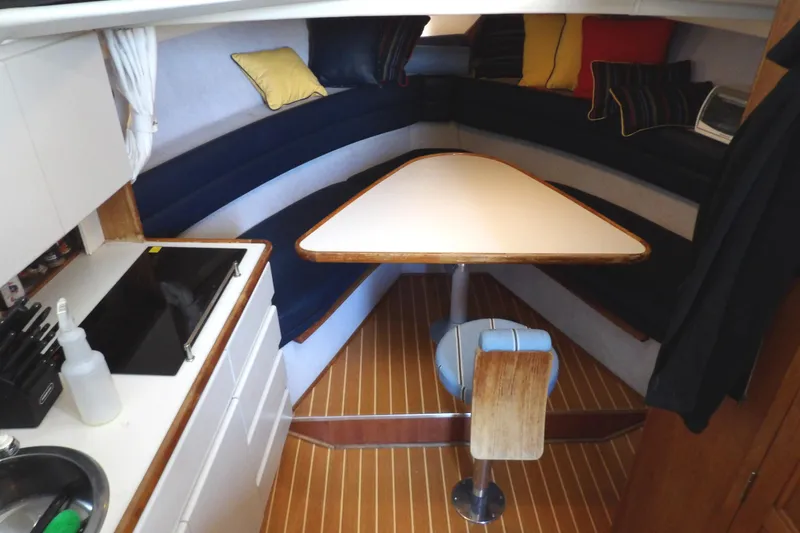Slide: The Image of Interior of 1992 Carver 28 Aft Cabin Motor Yacht with dining area and kitchenette. - 19
