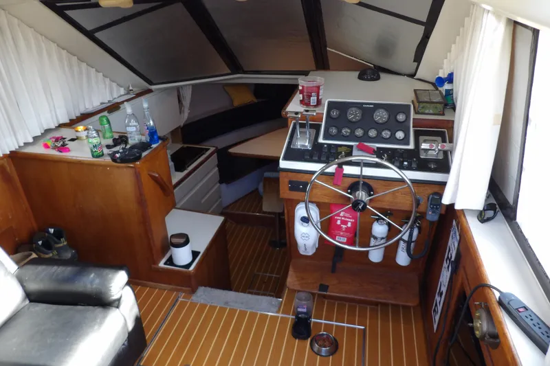 Slide: The Image of Interior of 1992 Carver 28 Aft Cabin Motor Yacht with helm and seating area. - 14