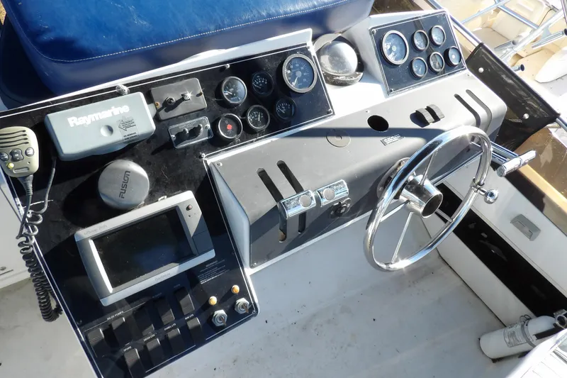 Slide: The Image of Control panel of a 1992 Carver 28 Aft Cabin Motor Yacht with navigation equipment. - 9