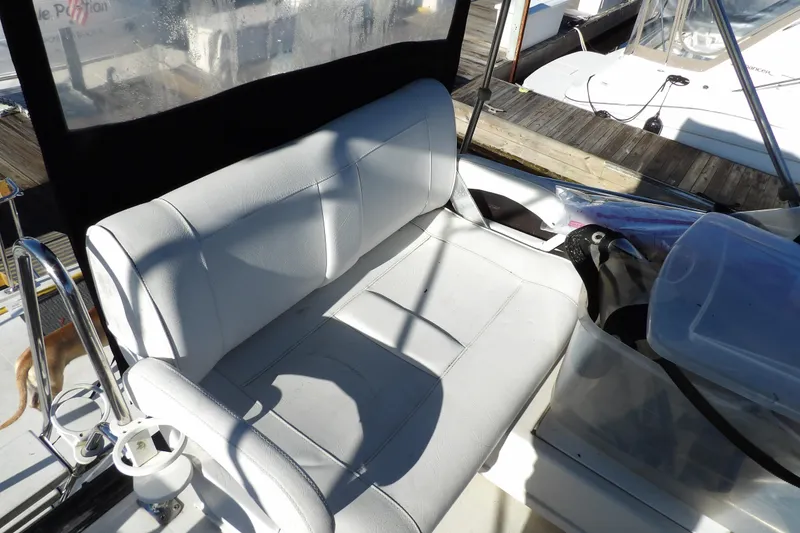 Slide: The Image of White seating area on 1992 Carver 28 Aft Cabin Motor Yacht, docked at marina. - 11