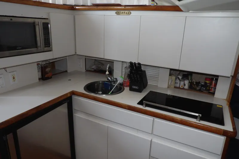 Slide: The Image of Kitchen area of 1992 Carver 28 Aft Cabin Motor Yacht with modern amenities. - 21