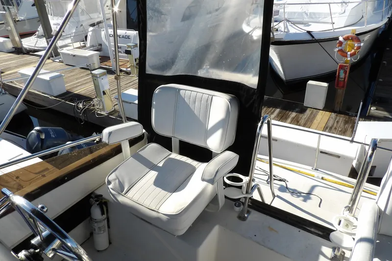 Slide: The Image of Captain's chair on 1992 Carver 28 Aft Cabin Motor Yacht at marina. - 12