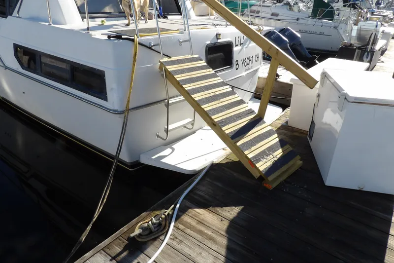 Slide: The Image of 1992 Carver 28 Aft Cabin Motor Yacht docked with wooden boarding ramp. - 5