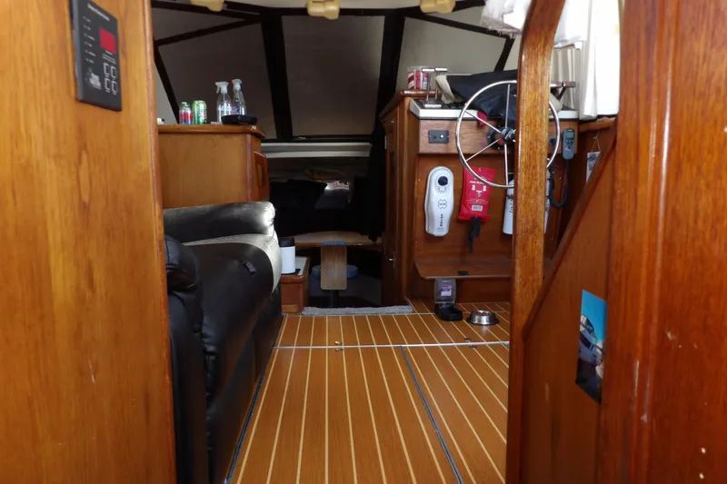 Slide: The Image of Interior of 1992 Carver 28 Aft Cabin Motor Yacht with wooden finish and steering wheel. - 22