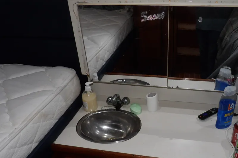 Slide: The Image of Interior of 1992 Carver 28 Aft Cabin Motor Yacht with sink and toiletries. - 27