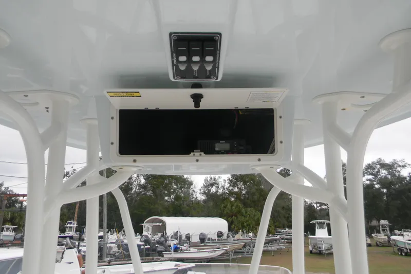 Slide: The Image of 2020 Contender 25 Bay boat console with storage compartment and control panel. - 11
