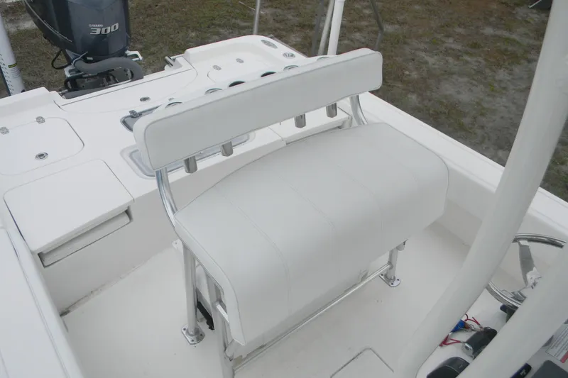 Slide: The Image of 2020 Contender 25 Bay boat interior with white seating and Yamaha 300 engine. - 14