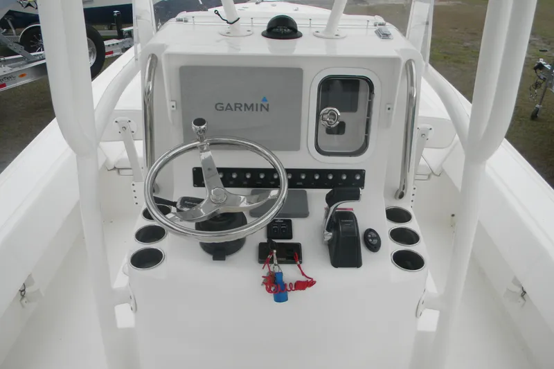 Slide: The Image of 2020 Contender 25 Bay boat console with Garmin navigation system and steering wheel. - 16