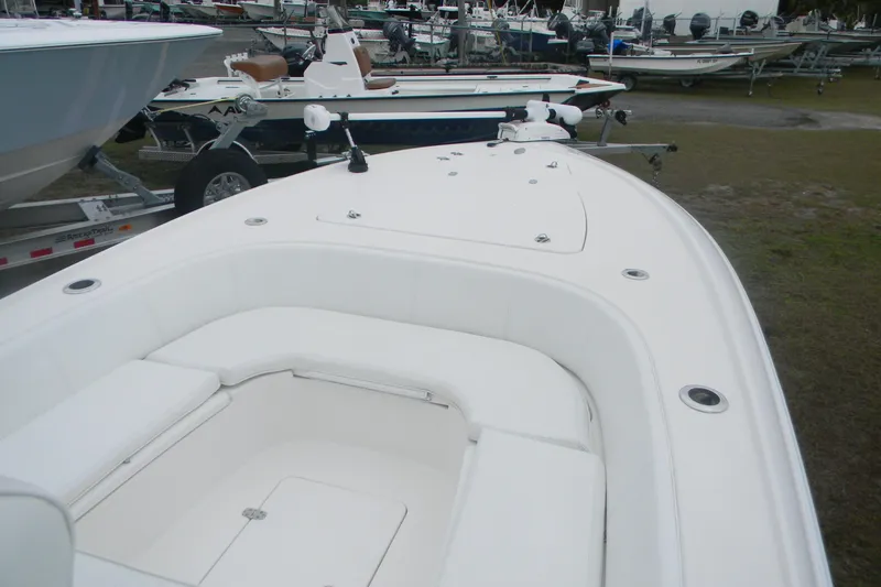 Slide: The Image of 2020 Contender 25 Bay boat with spacious seating, displayed outdoors. - 7
