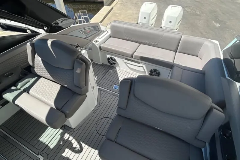 Slide: The Image of 2019 Cruisers Yachts 338 Outboard interior with gray seating and modern design. - 7