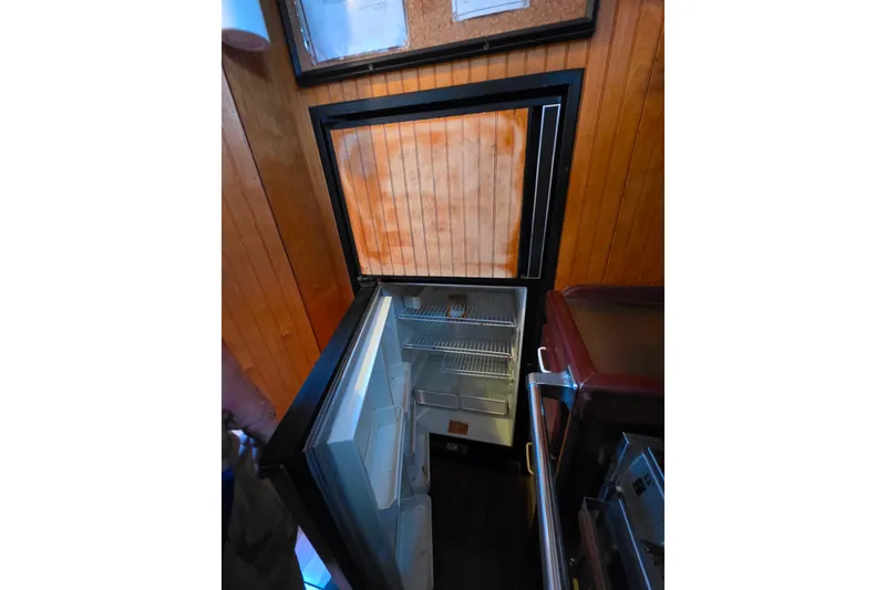 Slide: The Image of Open refrigerator in wooden interior, Glen-L 44, 2006 model. - 31