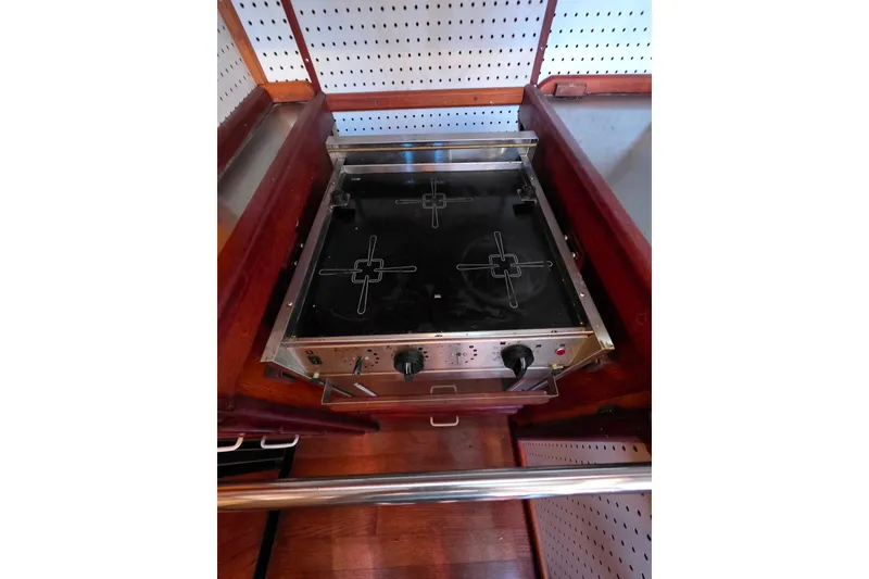 Slide: The Image of Electric stove in a Glen-L 44 boat, 2006 model, with wooden cabinetry. - 32