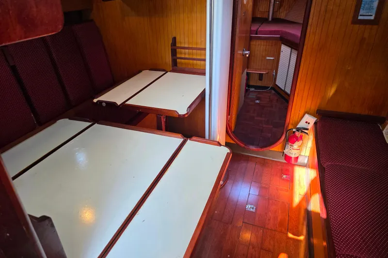 Slide: The Image of Interior of 2006 Glen-L 44 boat with wooden paneling and seating area. - 36