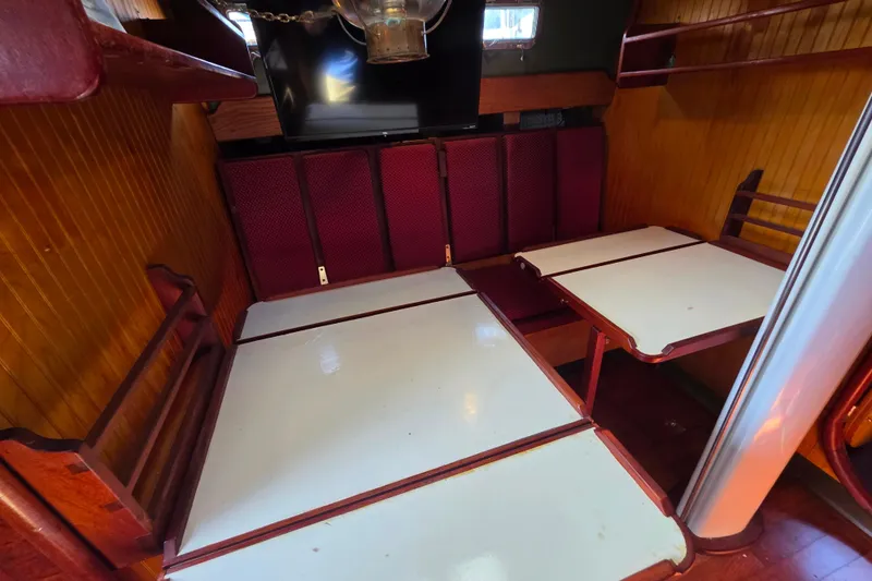 Slide: The Image of Interior of 2006 Glen-L 44 boat with wooden and white paneling. - 39