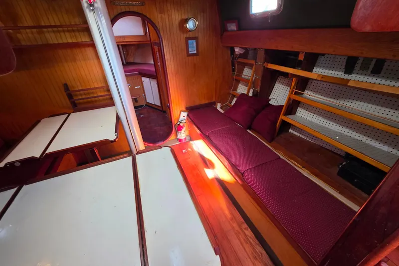 Slide: The Image of Interior of 2006 Glen-L 44 boat with wooden finish and cozy seating area. - 42