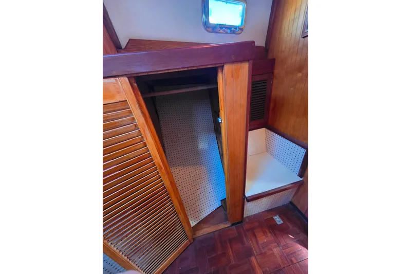 Slide: The Image of Interior of 2006 Glen-L 44 boat with wooden paneling and seating area. - 50