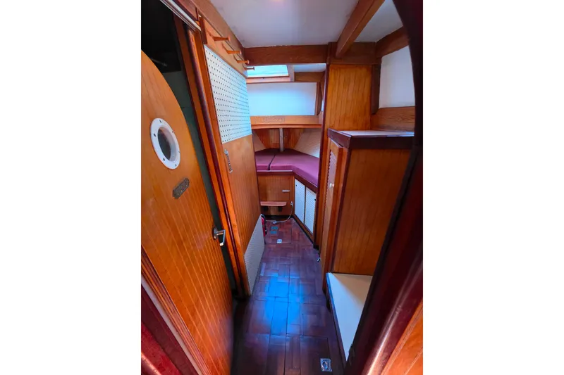 Slide: The Image of Interior of 2006 Glen-L 44 boat with wooden paneling and cozy cabin space. - 55