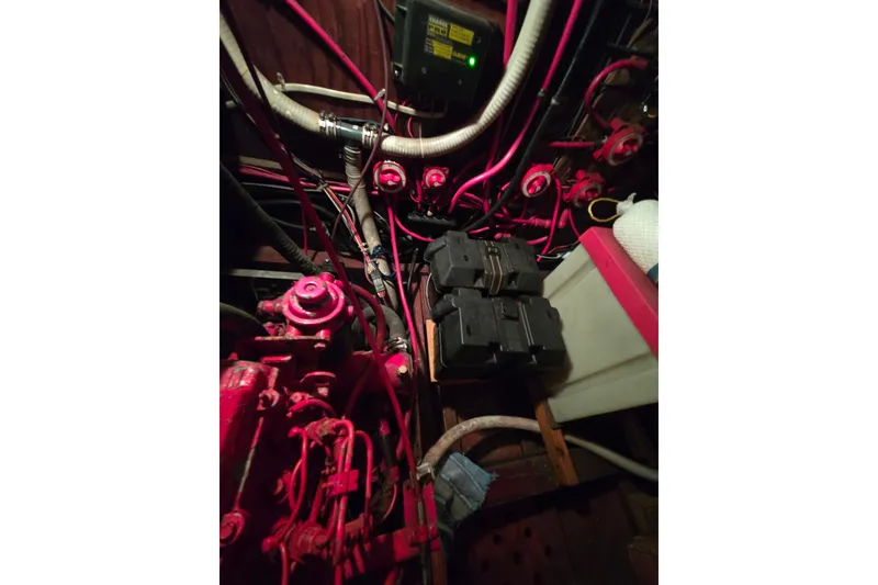 Slide: The Image of Engine room of a 2006 Glen-L 44 boat with visible wiring and components. - 71