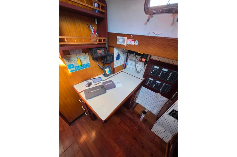 Slide: The Image of Navigation station of a 2006 Glen-L 44 boat with equipment and control panels. - 74