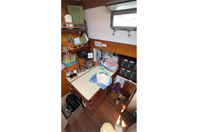 Slide: The Image of Interior of 2006 Glen L 44 boat with navigation station and storage. - 8