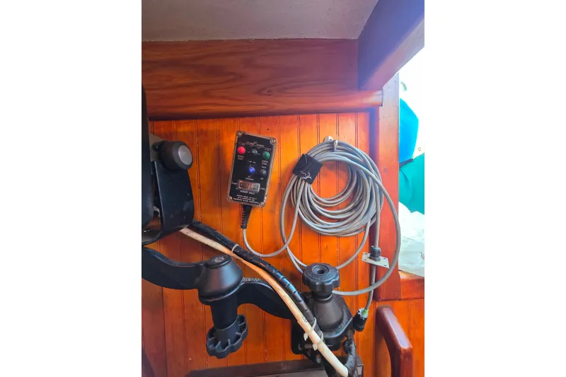 Slide: The Image of Control panel and coiled cable on Glen-L 44 boat, 2006 model. - 81