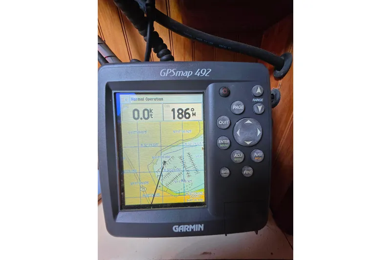 Slide: The Image of Garmin GPSmap 492 on Glen-L 44, 2006 model, displaying navigation data. - 89