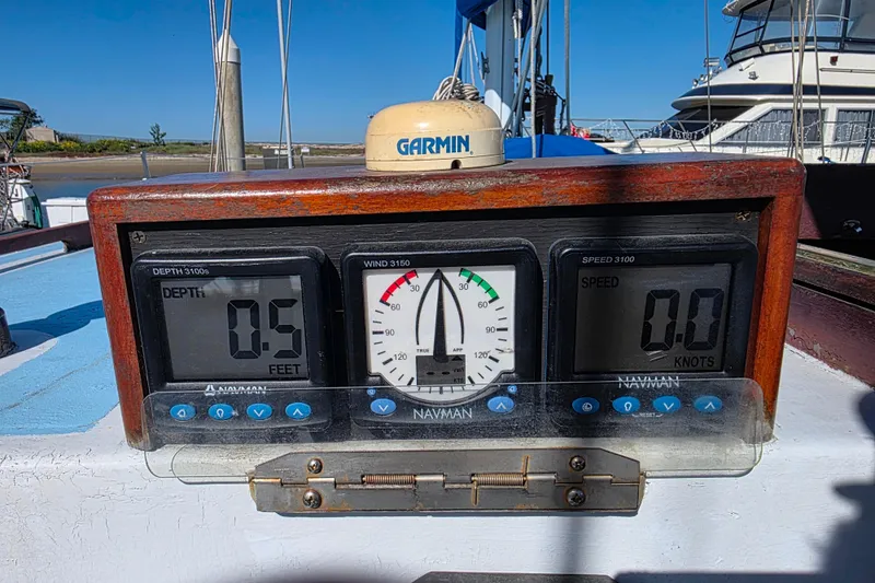 Slide: The Image of Instrument panel on a 2006 Glen-L 44 boat showing depth, wind, and speed readings. - 97