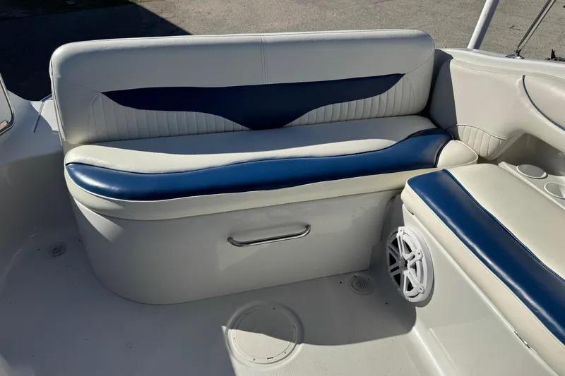 Slide: The Image of 2005 Crownline 236 LS boat interior with blue and white seating. - 7