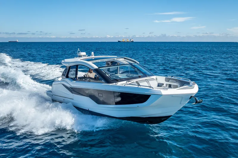Slide: The Image of 2023 Galeon 375 GTO luxury yacht cruising on open blue sea. - 10