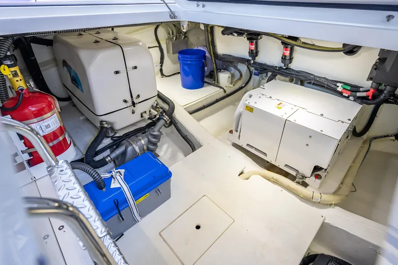 Slide: The Image of Engine room of 2023 Galeon 375 GTO yacht with equipment and fire extinguisher. - 11