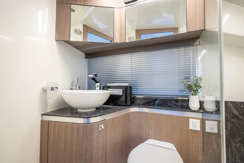 Slide: The Image of Modern bathroom interior in 2023 Galeon 375 GTO yacht with sleek fixtures and elegant design. - 13