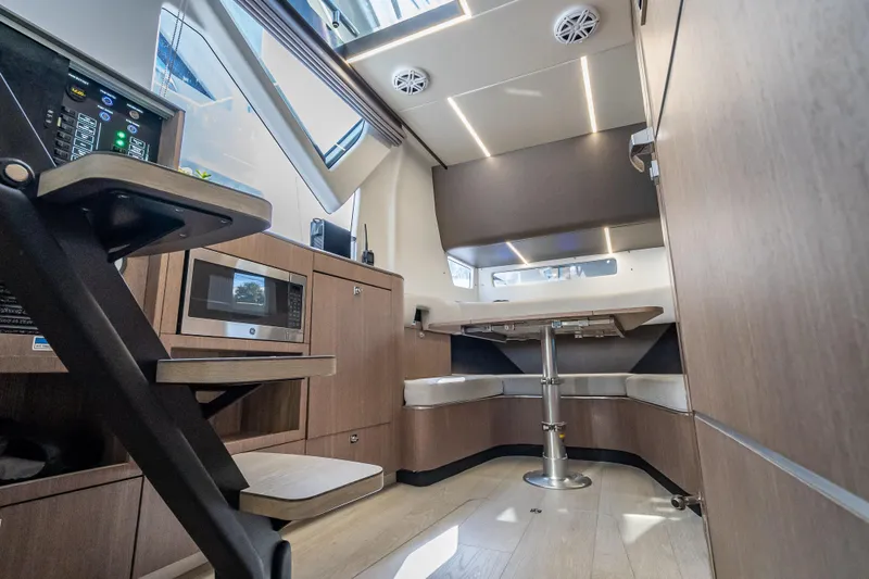 Slide: The Image of Interior of 2023 Galeon 375 GTO yacht with modern kitchen and seating area. - 17
