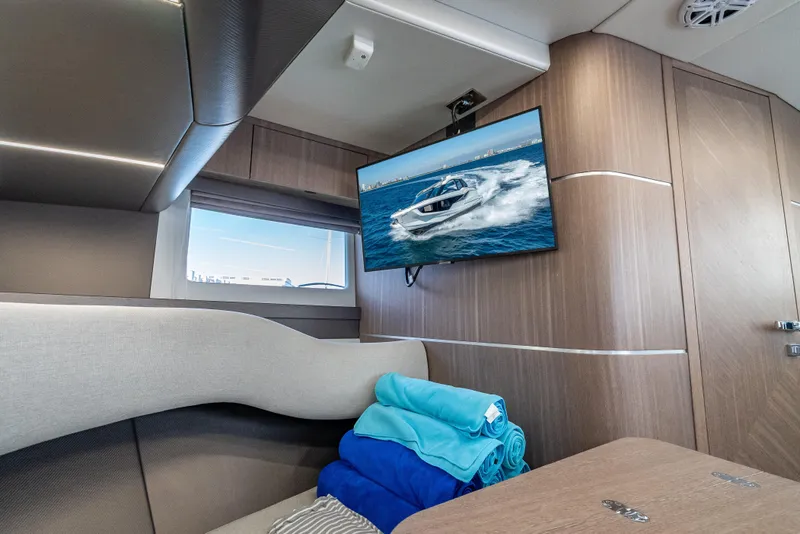 Slide: The Image of Interior of 2023 Galeon 375 GTO yacht with TV and folded towels. - 18