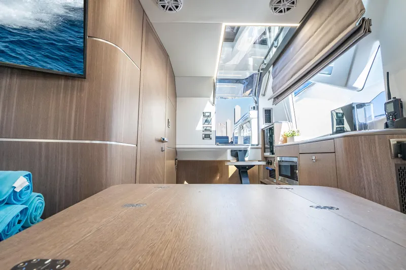 Slide: The Image of Luxurious interior of 2023 Galeon 375 GTO yacht with modern wood finishes and sleek design. - 19