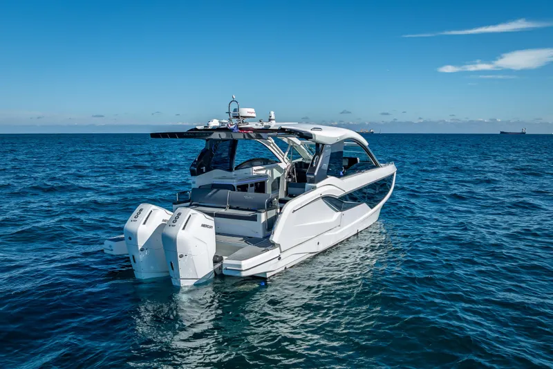 Slide: The Image of 2023 Galeon 375 GTO luxury yacht on open sea, showcasing sleek design and powerful engines. - 2