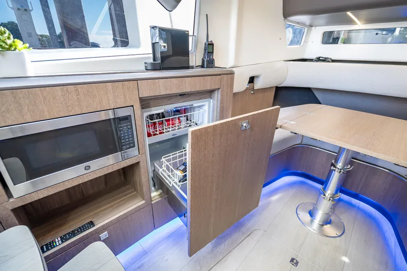 Slide: The Image of Modern interior of 2023 Galeon 375 GTO yacht with kitchenette and seating area. - 22