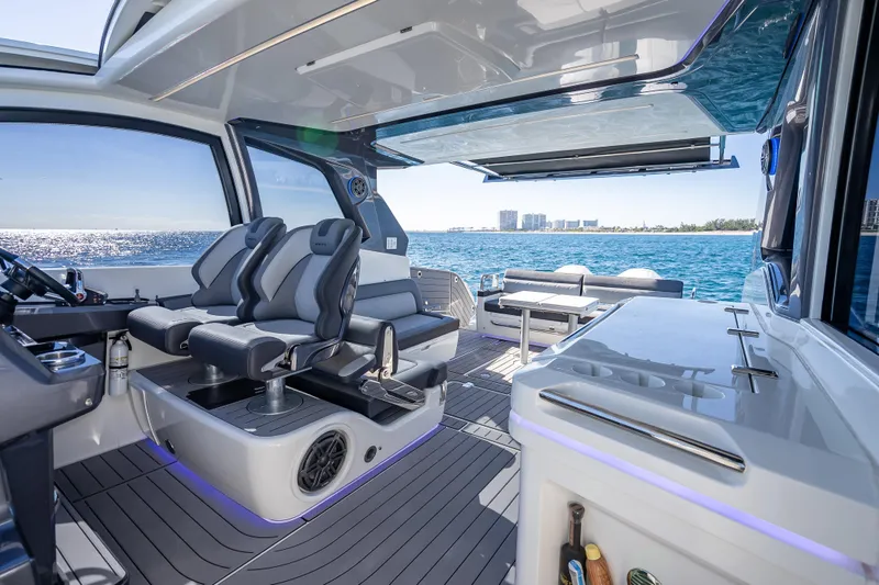 Slide: The Image of 2023 Galeon 375 GTO luxury yacht interior with ocean view and modern seating. - 26