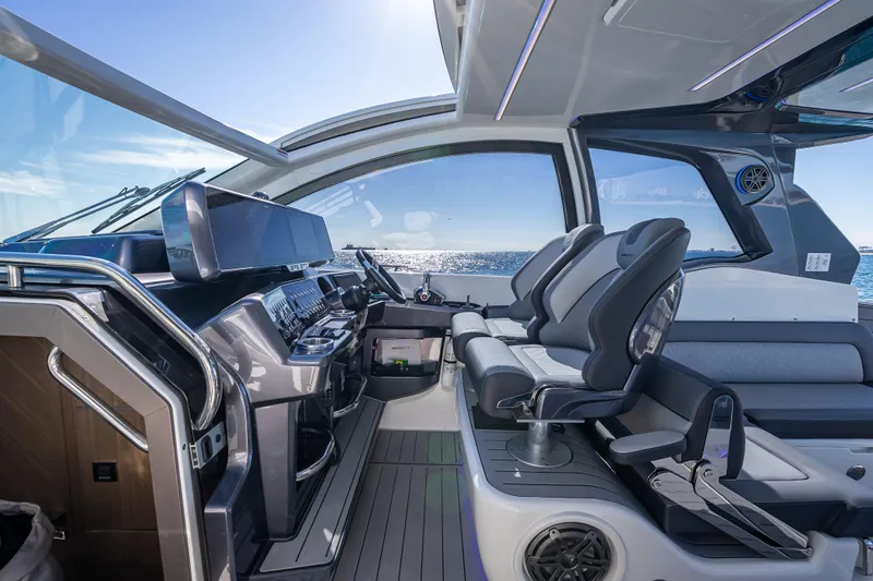 Slide: The Image of Interior of 2023 Galeon 375 GTO yacht with modern helm and seating. - 27