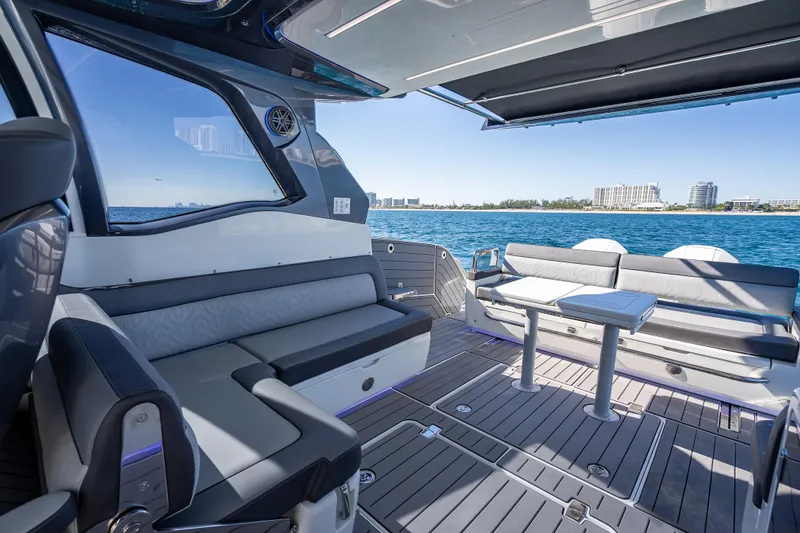 Slide: The Image of Luxurious 2023 Galeon 375 GTO yacht interior with sleek seating and ocean view. - 29
