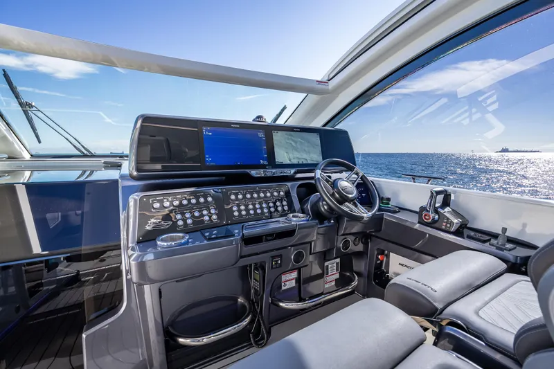 Slide: The Image of 2023 Galeon 375 GTO yacht cockpit with advanced navigation system and ocean view. - 30
