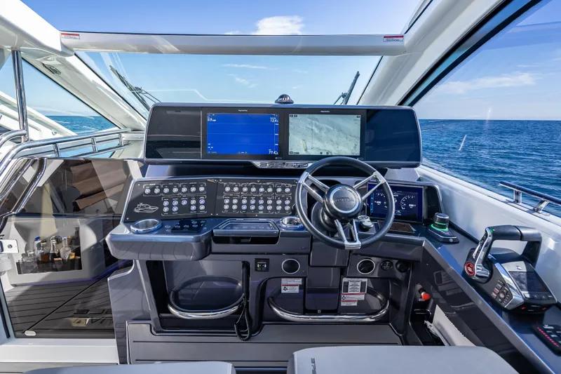 Slide: The Image of Cockpit of 2023 Galeon 375 GTO yacht with advanced navigation systems and ocean view. - 31