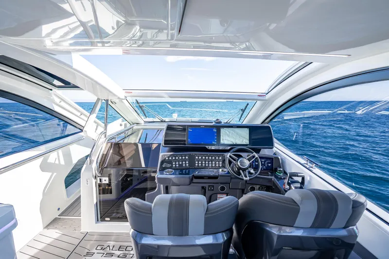 Slide: The Image of Interior view of 2023 Galeon 375 GTO yacht cockpit with ocean backdrop. - 32